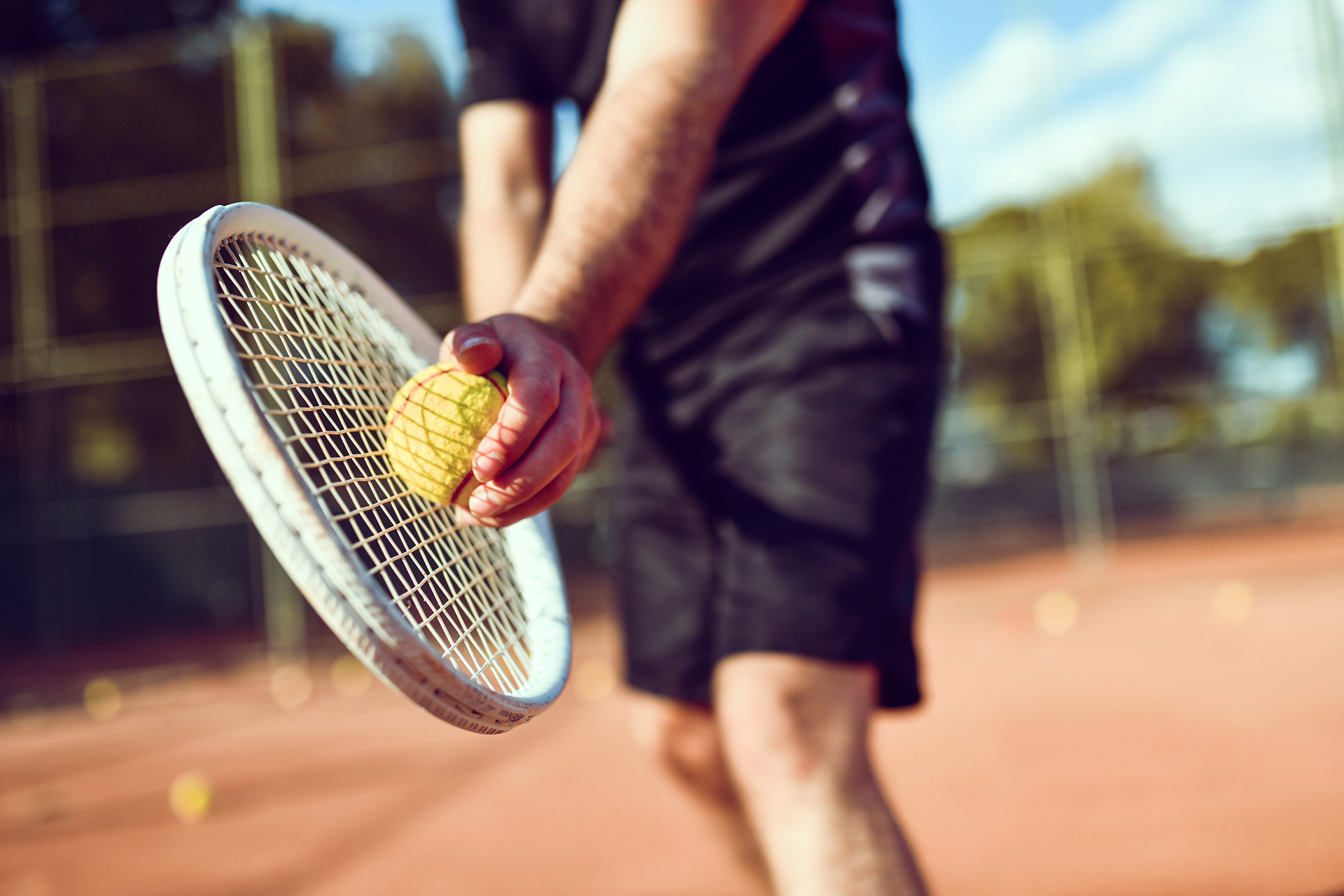 tennis player with racket and ball