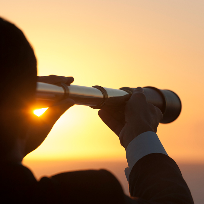 looking through a telescope at sunset